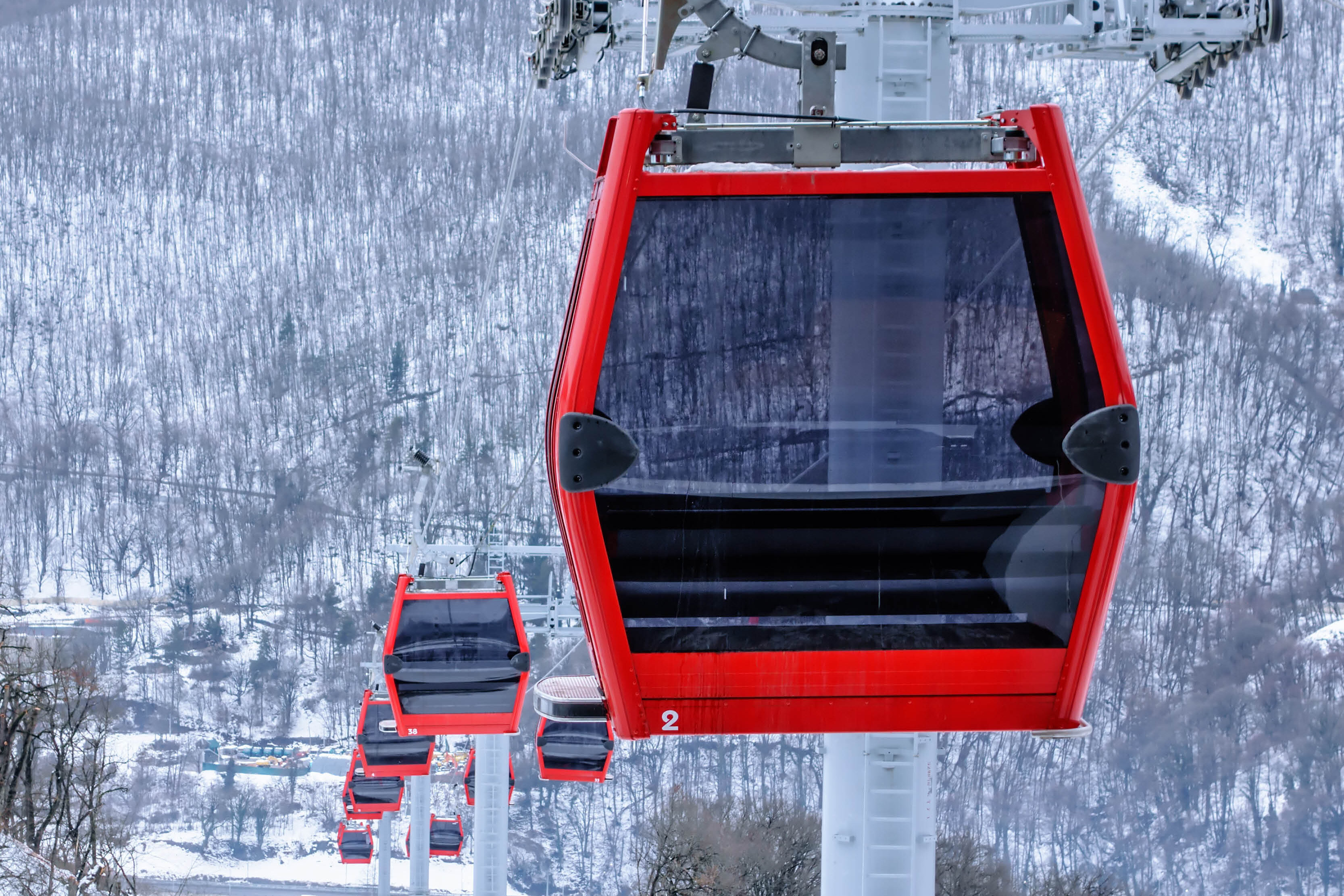 Red gondola in snowy area