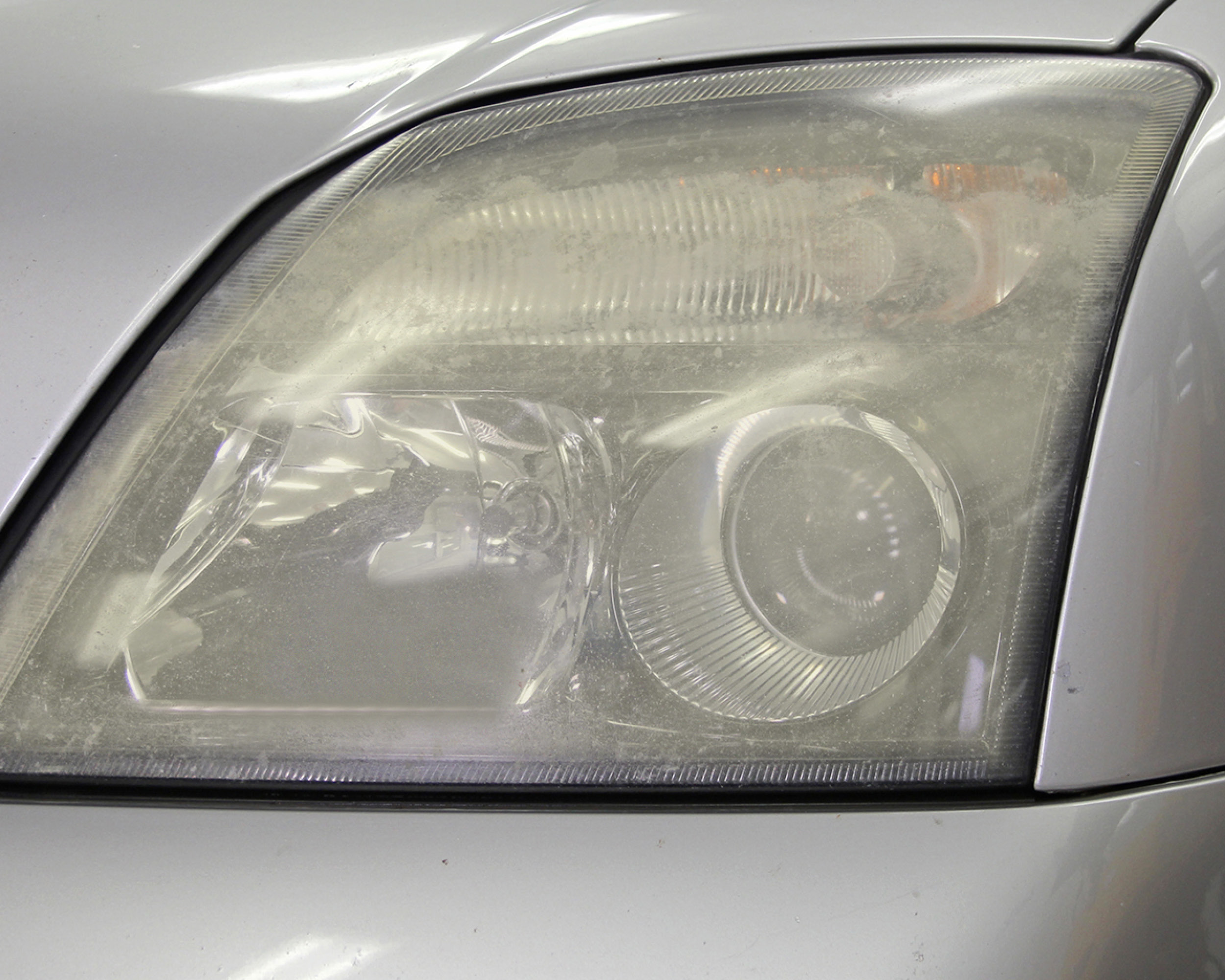 Headlight lens recoating