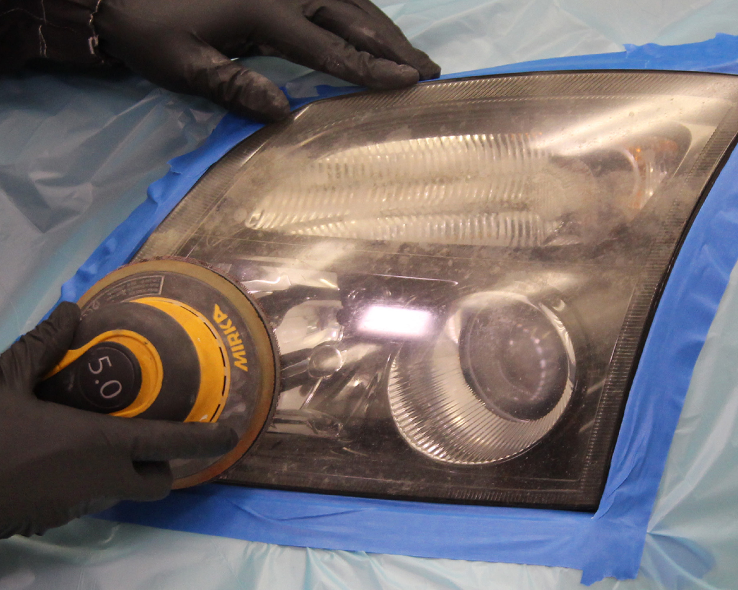 Headlight lens recoating