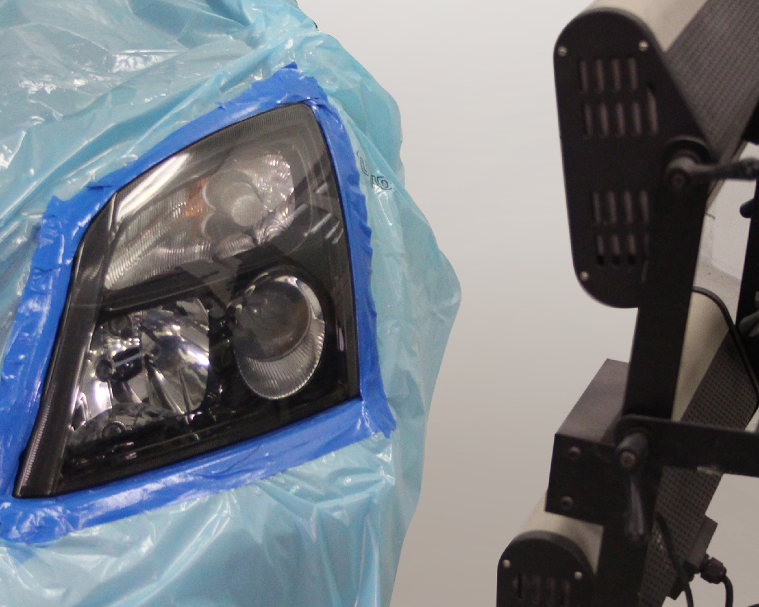 Headlight lens recoating