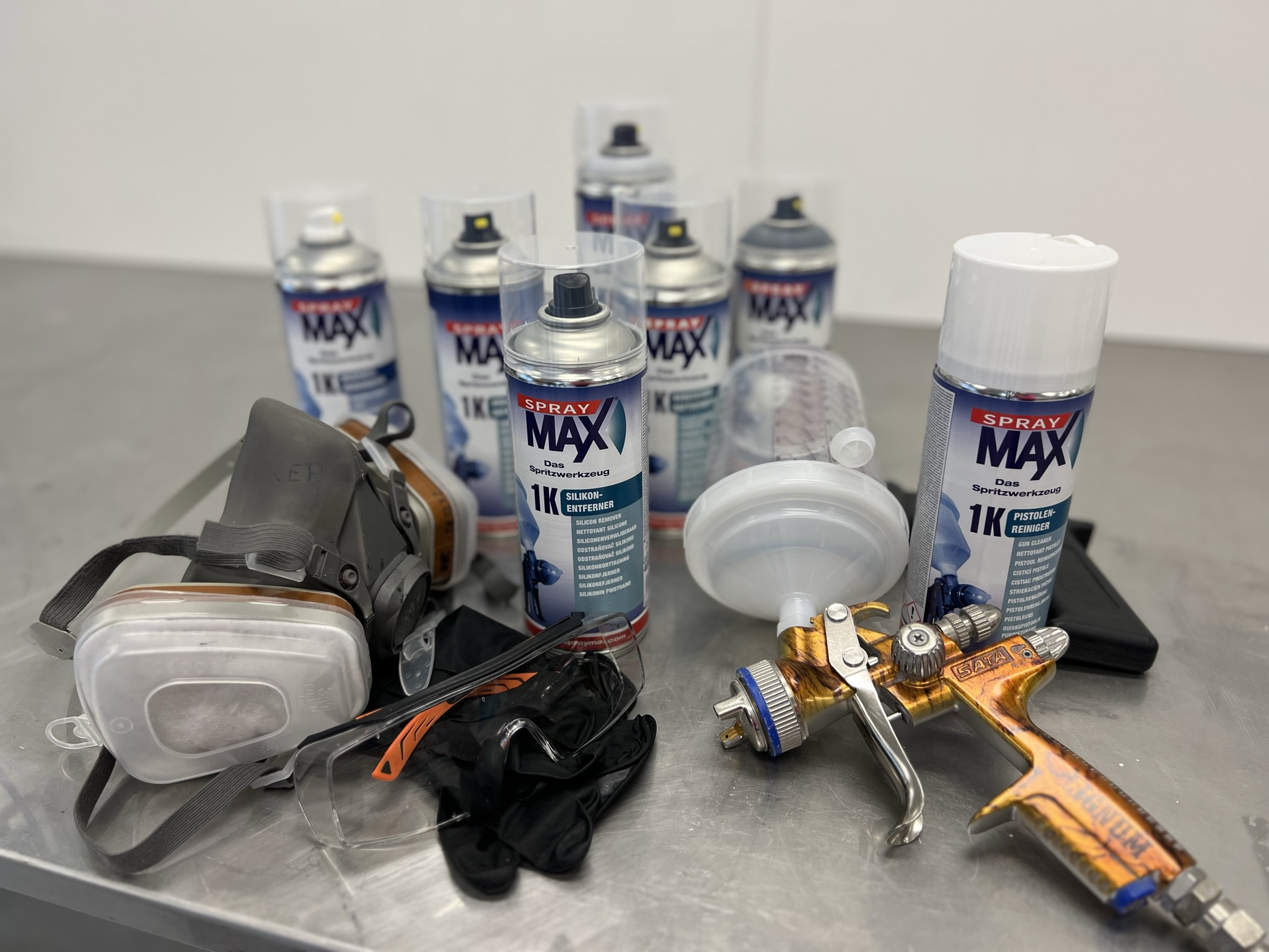 Spray cans, spray guns, and cans